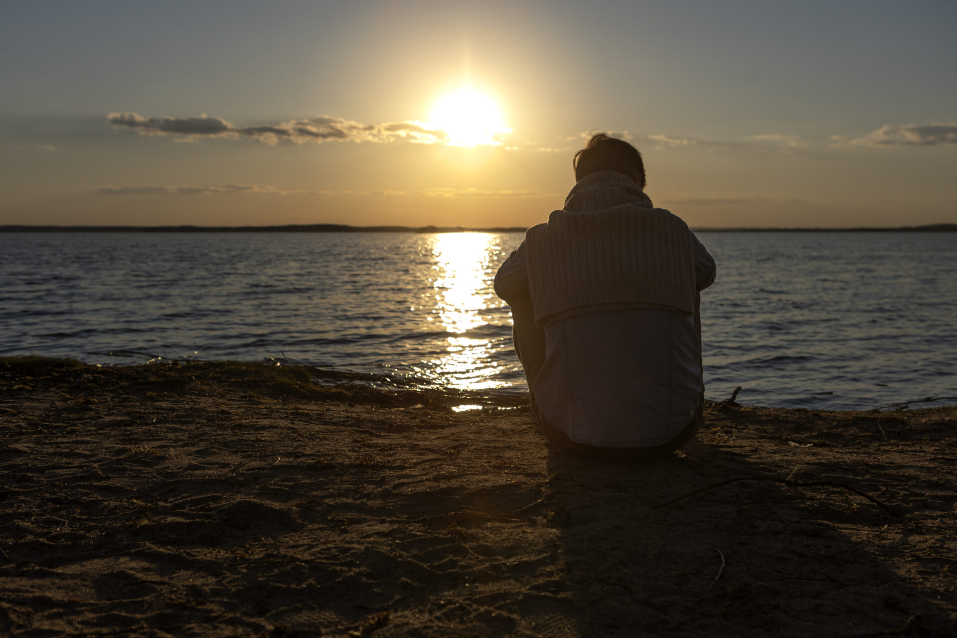 sad-contemplative-person-near-lake