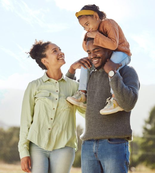 Parents, kids and happy family in park, garden and sunshine field outdoors for bonding, love and quality time together. Mom, dad and girl child of black family having fun, relax and care in nature.
